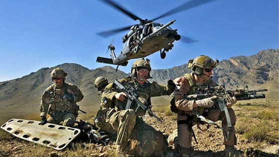 An HH-60G Pave Hawk hovers over pararescuemen and Brig. Gen. Jack L. Briggs, the 455th Air Expeditionary Wing commander, during a training mission at Bagram Airfield, Afghanistan, Sept. 24, 2010. The training mission provided a glimpse of what the 33rd Expeditionary Rescue Squadron brings to the fight and the capabilities it provides to combat commanders. (U.S. Air Force photo/Staff Sgt. Christopher Boitz)