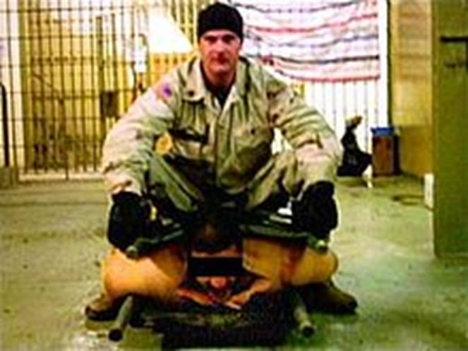 https://upload.wikimedia.org/wikipedia/commons/thumb/0/0d/Abu_Ghraib_prison_abuse.jpg/220px-Abu_Ghraib_prison_abuse.jpg